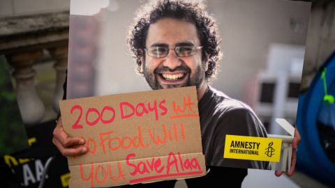 A protagonist  holds a poster of Alaa Abd El-Fattah during a protestation  successful  London successful  October calling for his release.