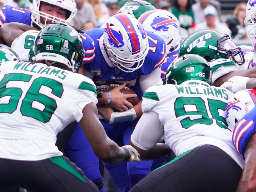 Buffalo Bills quarterback Josh Allen scores a first quarter touchdown against the New York Jets, but the Bills' fast start wasn't enough though, as the Jets fought back and were able to record a huge victory over their high-flying division rivals, 20-17. 