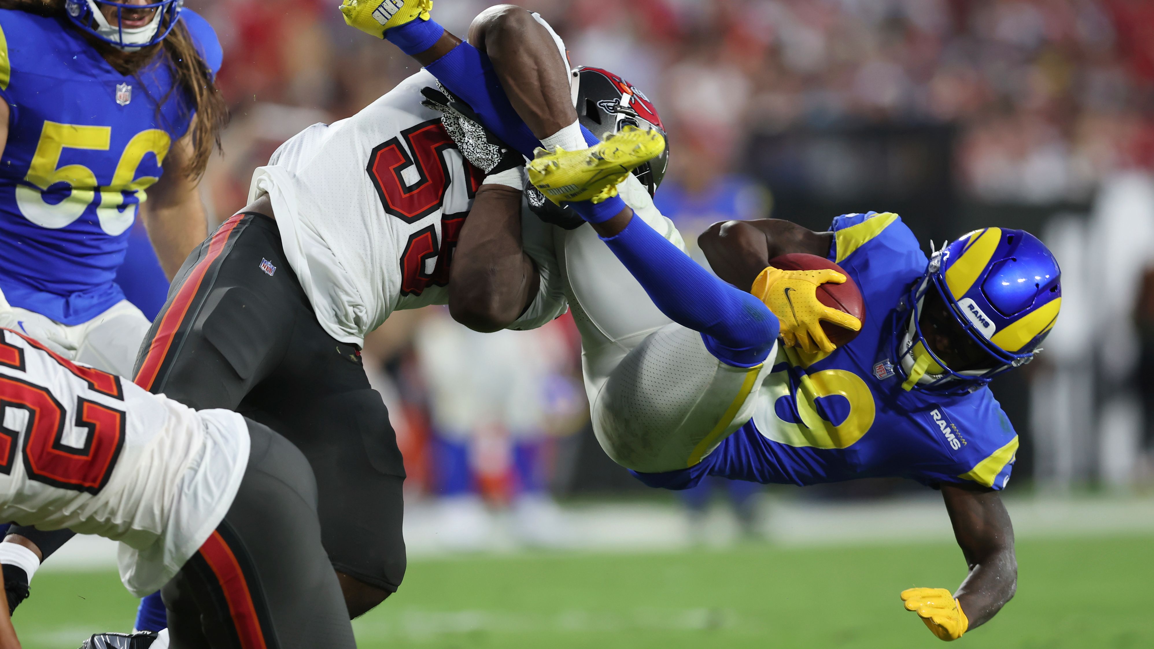 Los Angeles Rams wide receiver Brandon Powell is acrobatically tackled by Tampa Bay Buccaneers linebacker Genard Avery during the first half of their game at Raymond James Stadium. Bucs quarterback <a href="index.php?page=&url=https%3A%2F%2Fwww.cnn.com%2F2022%2F11%2F07%2Fsport%2Ftom-brady-100k-passing-yards-bucs-rams-spt-intl%2Findex.html" target="_blank">Tom Brady threw a one-yard touchdown</a> to tight end Cade Otton with 13 seconds left to complete a 16-13 comeback victory over the reigning Super Bowl champions. 