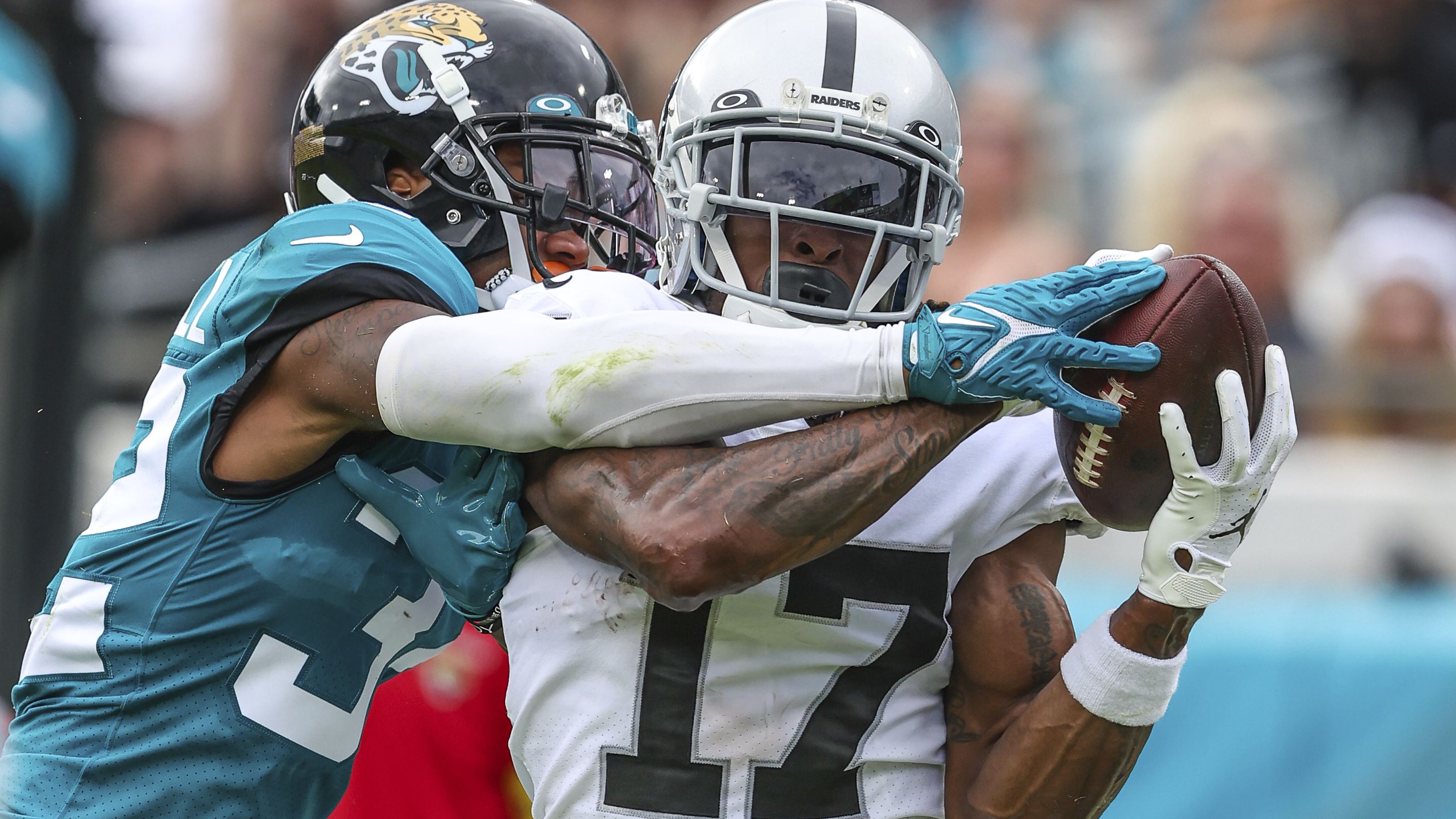 Las Vegas Raiders wide receiver Davante Adams catches a pass for a touchdown while being tightly defended by Jacksonville Jaguars cornerback Tyson Campbell. Despite another excellent afternoon for Adams — finishing with 146 receiving yards and two touchdowns — the Raiders were beaten 27-20 by the Jags. 