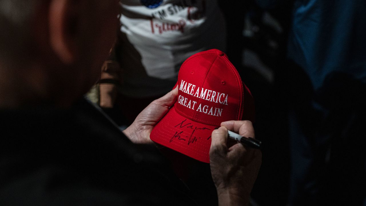 McCarthy signs a "Make America Great Again" hat after an event featuring south Texas Republican congressional candidates in McAllen on Sunday.