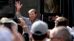 Georgia Republican Gov. Brian Kemp waves as he steps off his tour bus at a campaign rally Tuesday, Nov. 1, 2022, in Cumming, Ga.  Kemp is running for a second term over Democratic challenger Stacey Abrams.  (AP Photo/John Bazemore)