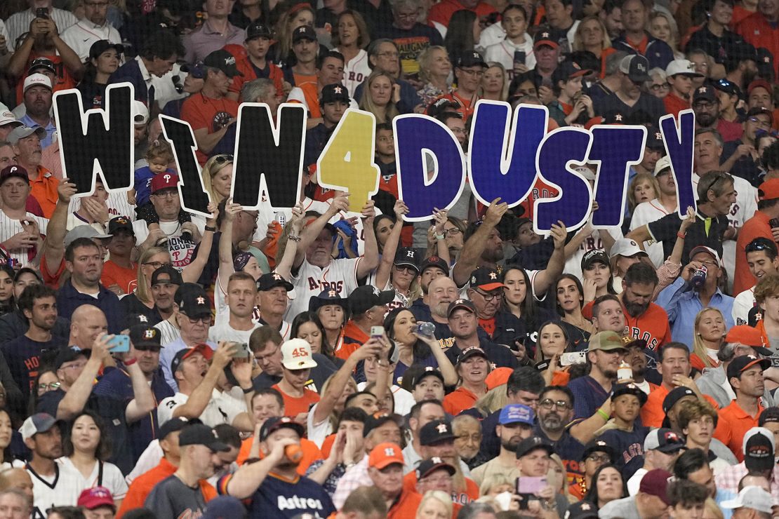 Fans hold up a sign for Houston Astros manager Dusty Baker during Game 6.