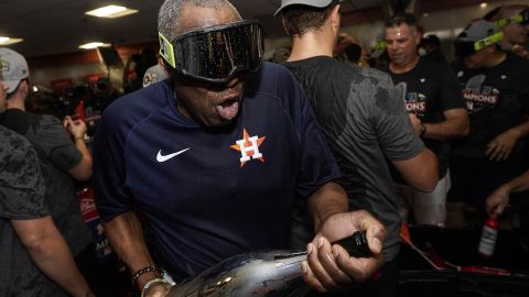 Dusty Baker celebrates in the locker room.
