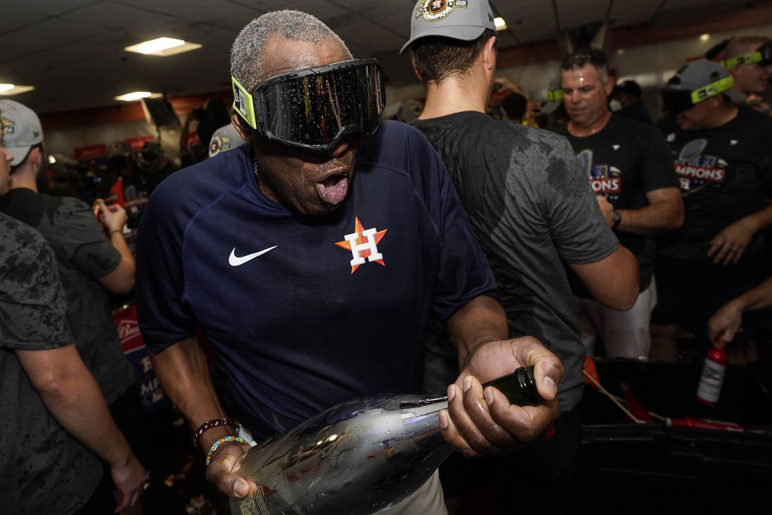 Dusty Baker celebrates in the locker room.