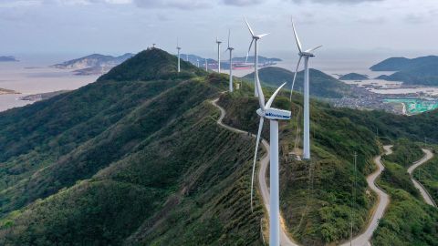 Turbines spin at Qushandao Wind Farm in Zhejiang province, China, on November 1.