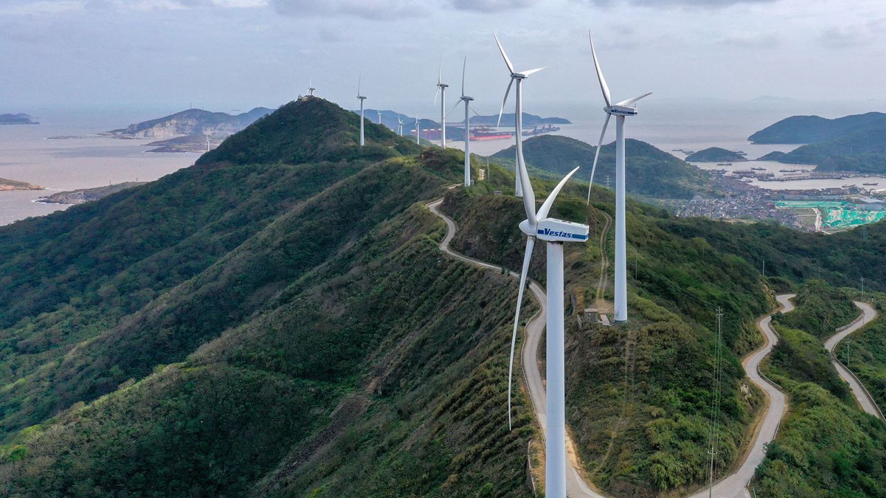 Turbines spin at the Qushandao Wind Farm in Zhejiang Province, China, on November 1.