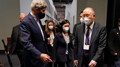 China's chief climate negotiator Xie Zhenhua, right, walks with John Kerry, US Special Presidential Envoy for Climate, at last year's UN climate summit in Glasgow, Scotland.