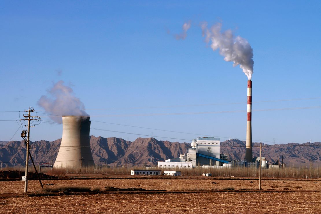 Smoke rises from the chimney of a coal-fired power plant in Gansu Province, China, in February. China and the US have historically been the largest greenhouse gas emitters.