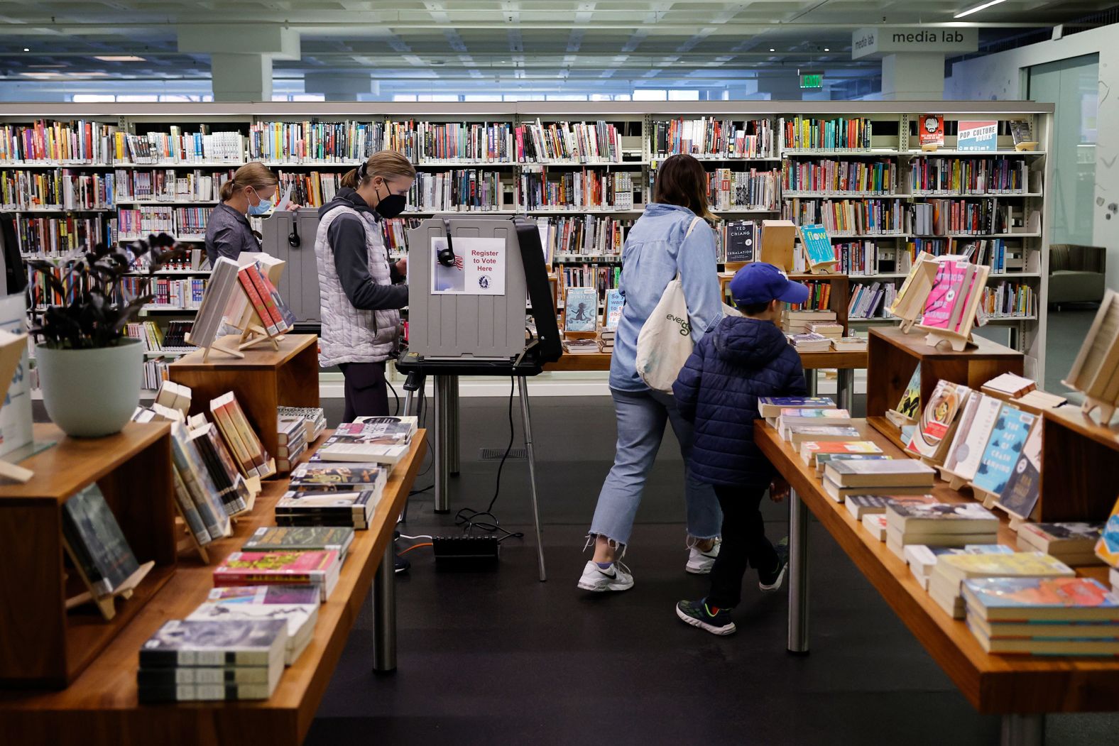 Voters in Milwaukee fill out their absentee ballots at the Madison Central Public Library on November 6.