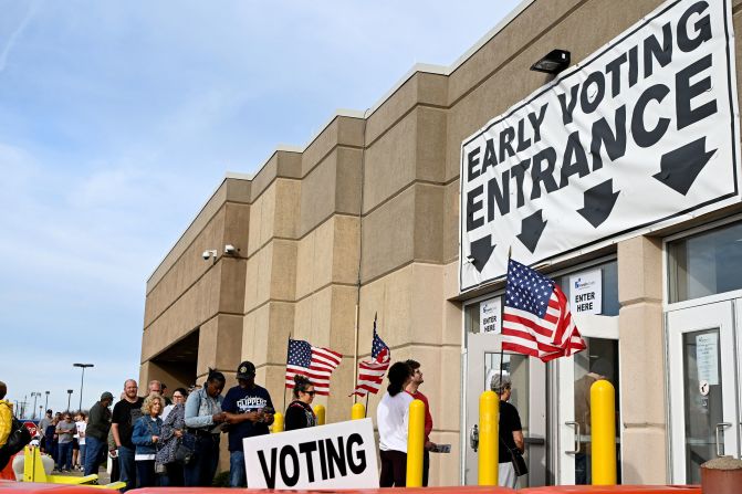 People wait in line to cast their ballots in Columbus on November 5.