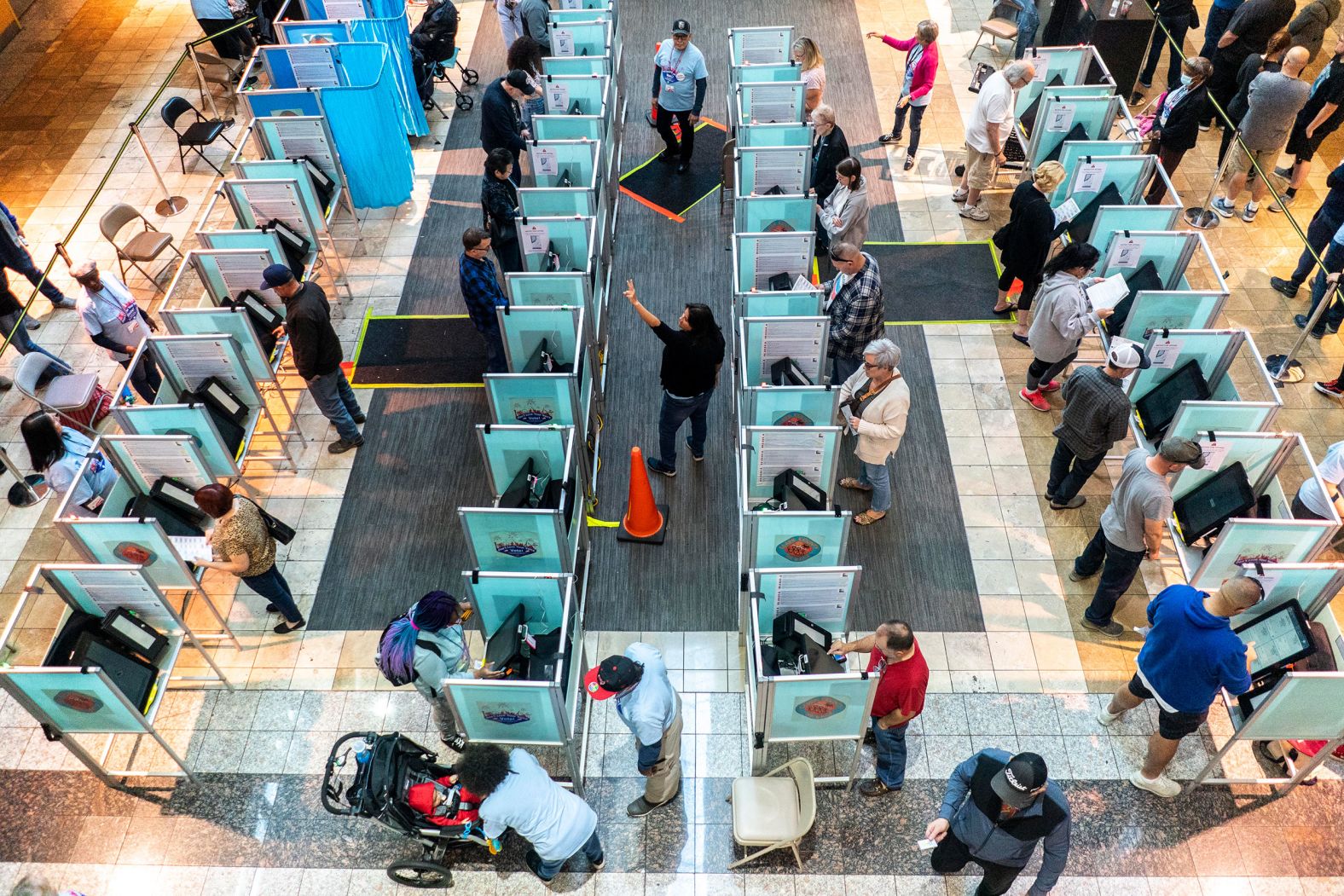 Clark County poll workers usher in long lines of voters in Las Vegas on November 4.