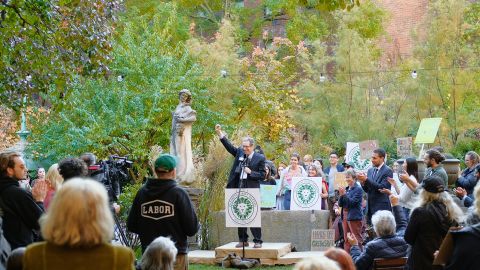 Norman Siegel, the lawyer for Elizabeth Street Garden Inc., cheers during a press conference announcing their legal victory.