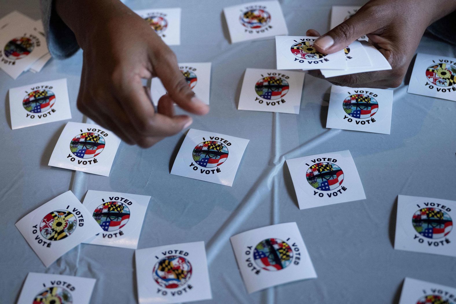 A poll worker in Silver Spring puts out stickers for voters on October 28.