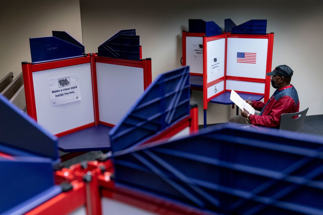 Cornelius Whiting fills out his ballot at an early voting location in Alexandria, Virginia, on Monday, September 26.