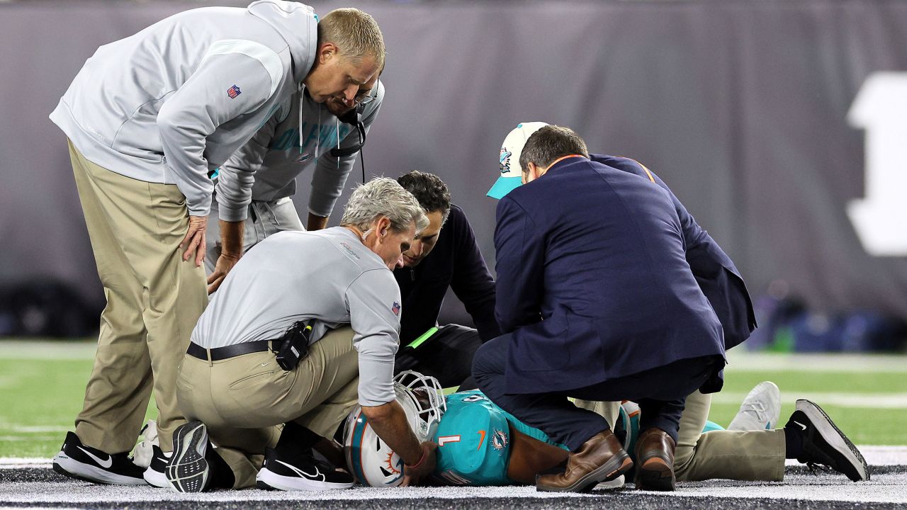 Medical staff tend to Miam Dolphins quarterback Tua Tagovailoa after he took a hit during a September 29 game against the Cincinnati Bengals.