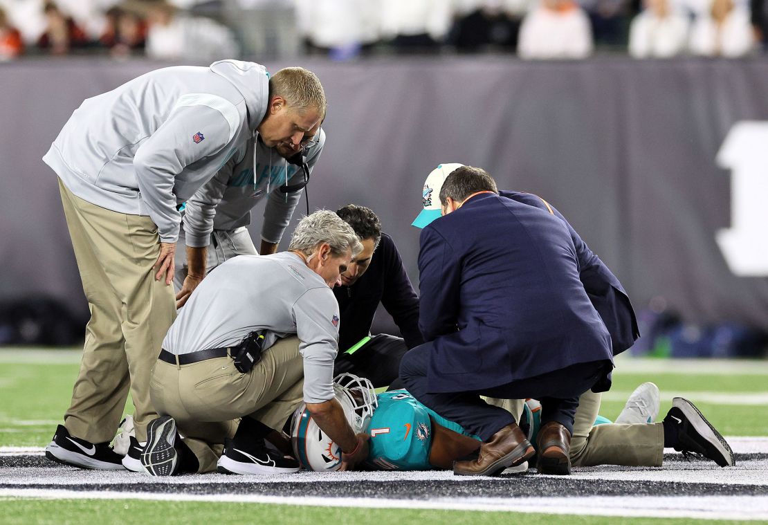 Medical staff tend to Miam Dolphins quarterback Tua Tagovailoa after he took a hit during a September 29 game against the Cincinnati Bengals.