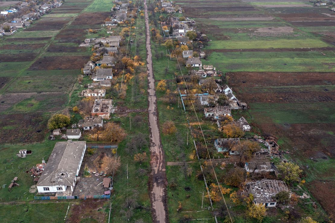 Buildings that were damaged during fighting between Ukrainian and Russian occupying forces line a village road on October 30 in the Kherson region of Ukraine.