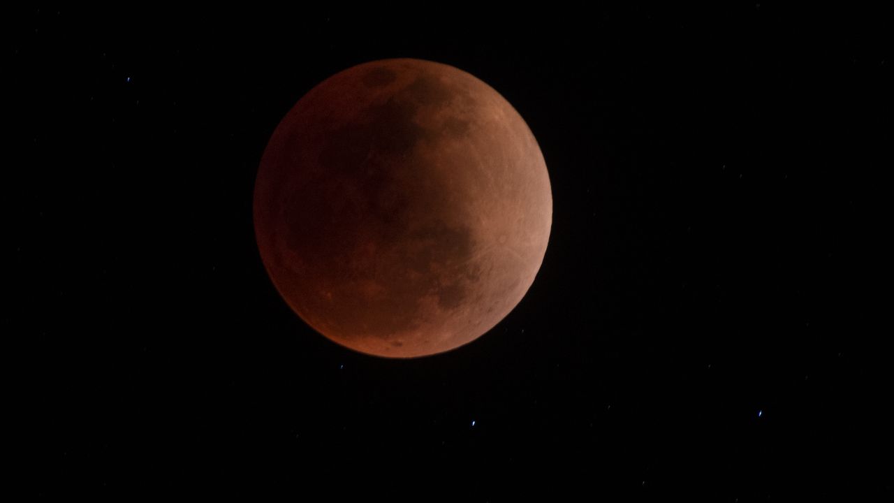 A "blood moon" is visible during a total lunar eclipse in the skies of Canta, Peru, on May 15.