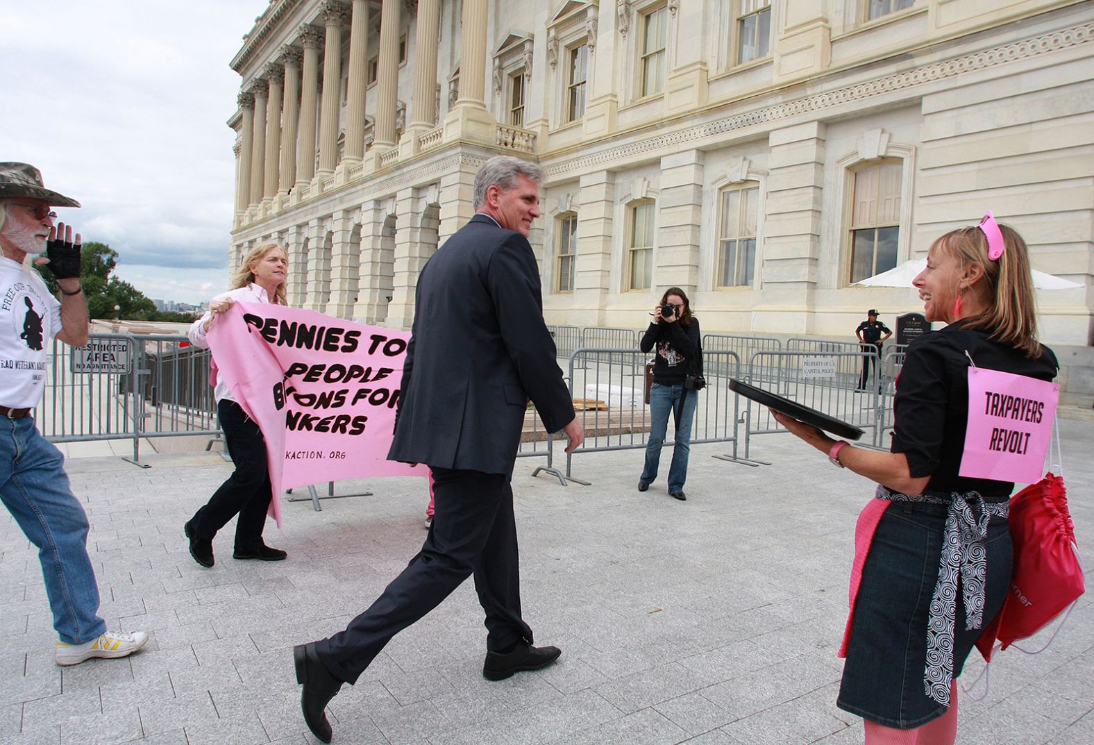 McCarthy listens to protesters on his way to the House Chamber, where he voted against a financial bailout package in September 2008.