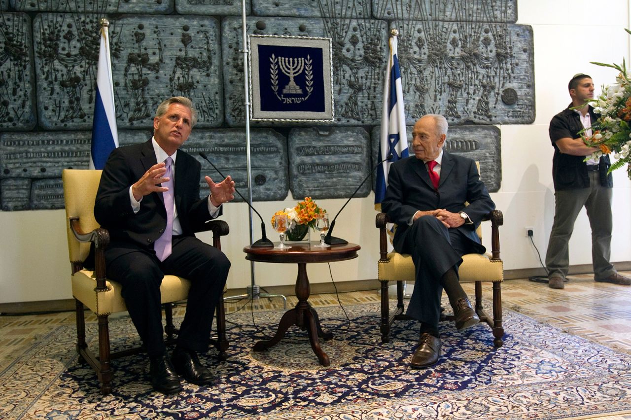 McCarthy sits with Israeli President Shimon Peres during a meeting in Jerusalem in August 2011.
