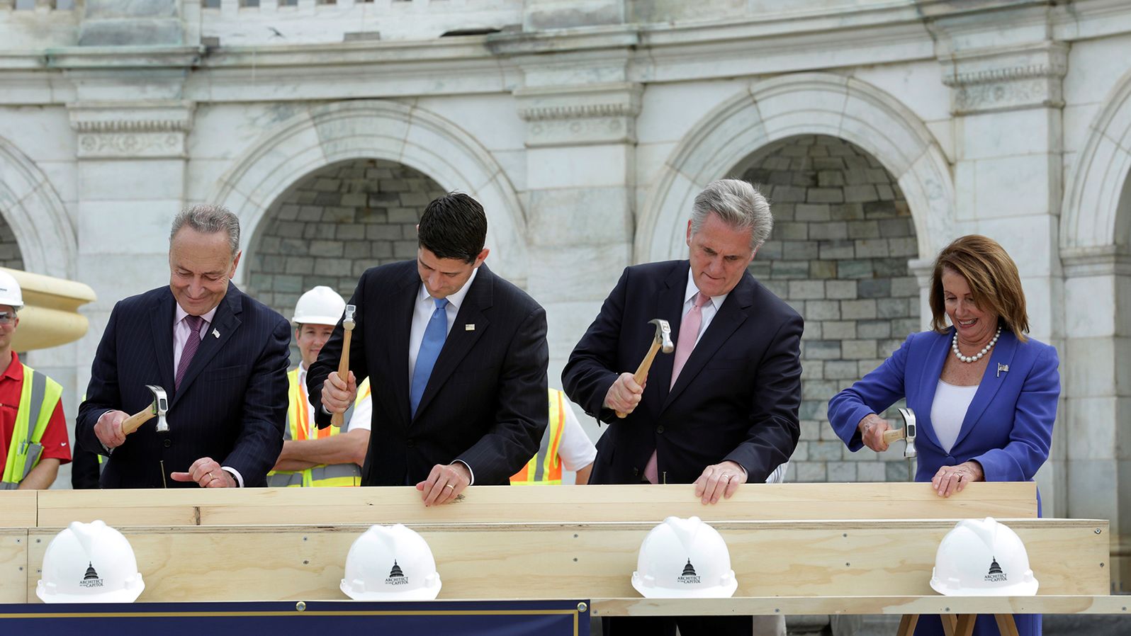 From left, US Sen. Chuck Schumer, House Speaker Paul Ryan, House Majority Leader Kevin McCarthy and House Minority Leader Nancy Pelosi participate in a "first nail ceremony" kicking off the construction of an inauguration platform at the Capitol in 2016.