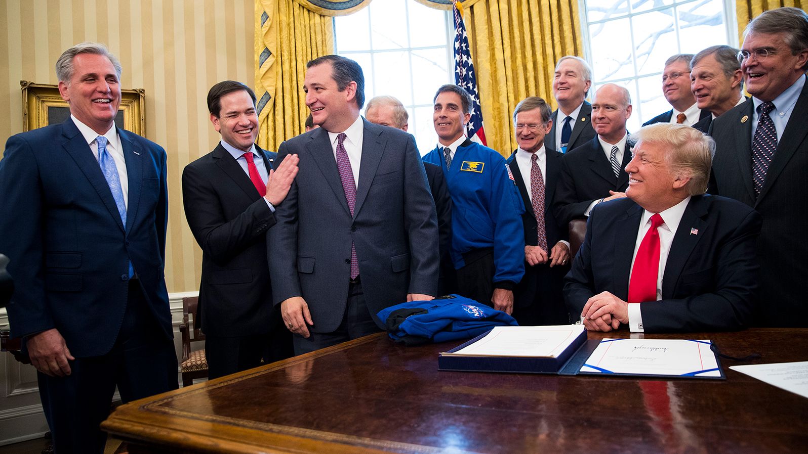 McCarthy, left, shares a laugh with US Sens. Marco Rubio and Ted Cruz as President Donald Trump signs a NASA appropriations bill in March 2017.