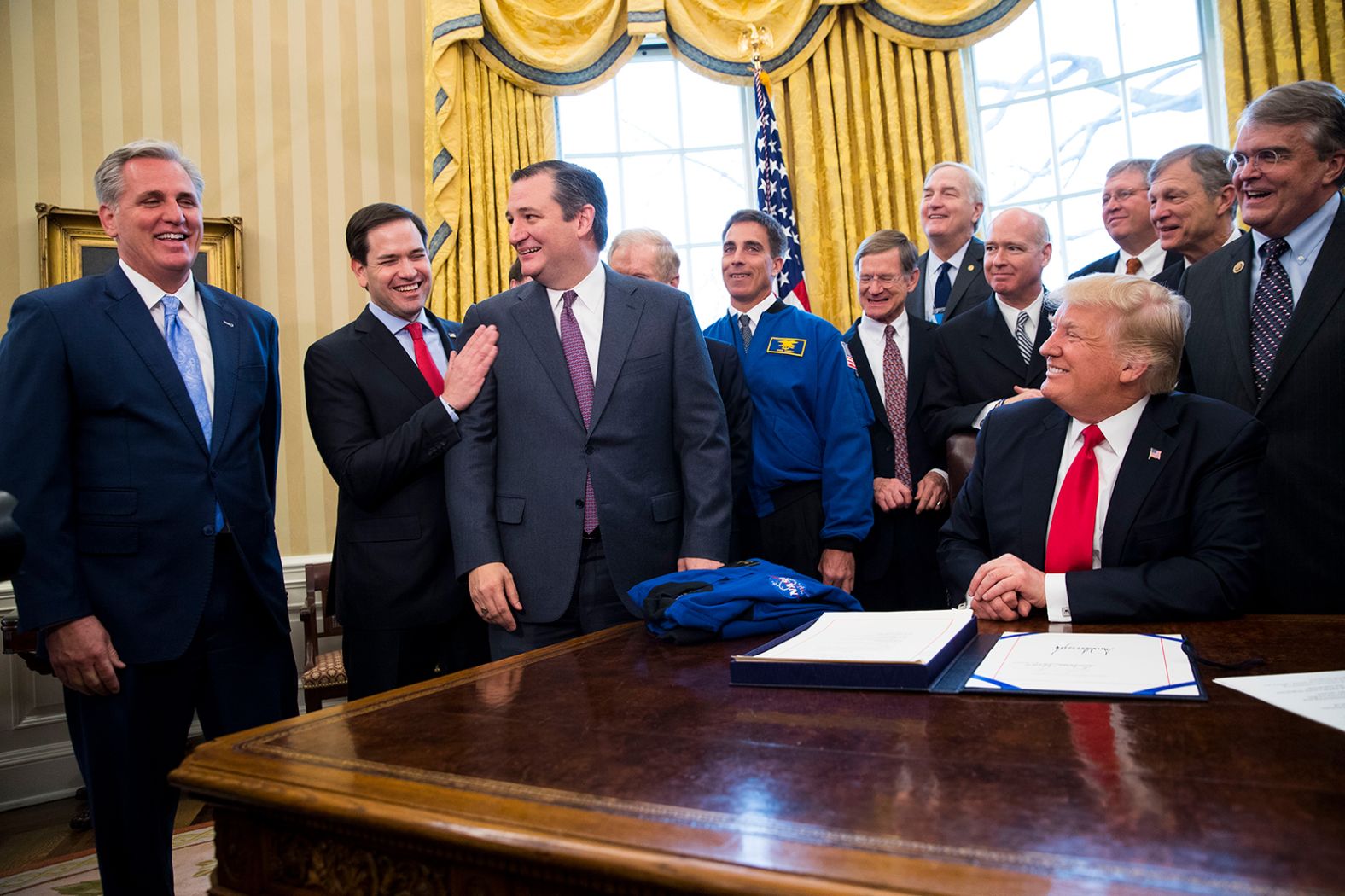 McCarthy, left, shares a laugh with US Sens. Marco Rubio and Ted Cruz as President Donald Trump signs a NASA appropriations bill in March 2017.