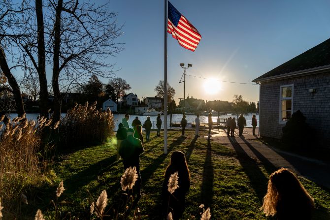 Voters line up to cast their ballots at the Aspray Boat House in Warwick, Rhode Island.