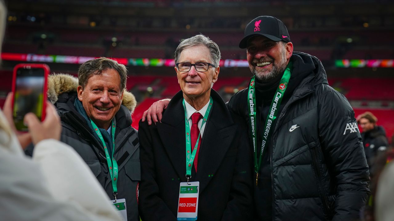 Klopp is pictured with Liverpool Chairman Tom Werner and club owner John W. Henry at Wembley Stadium in February 2022.