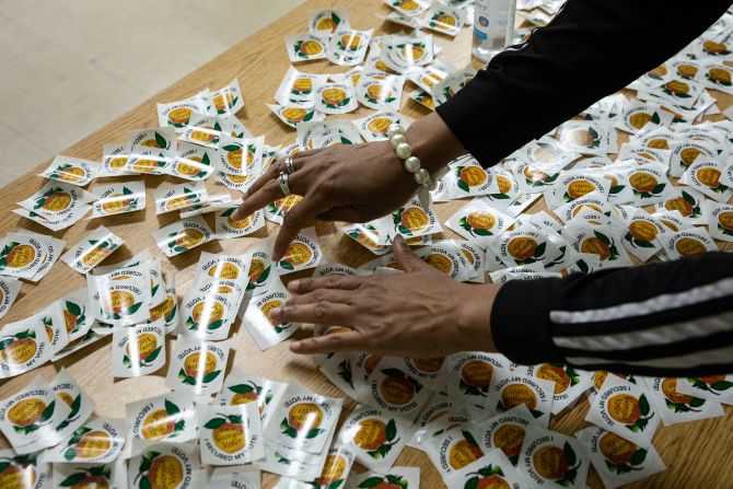 An election official arranges voting stickers at a polling location in Atlanta on Election Day.