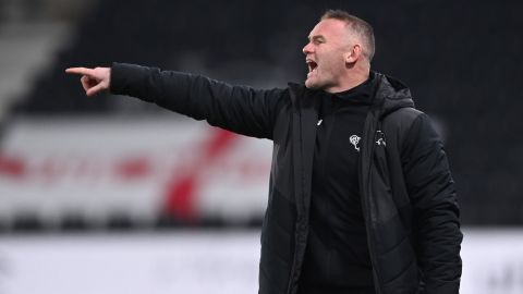 Wayne Rooney instructs his team during a Derby County match.