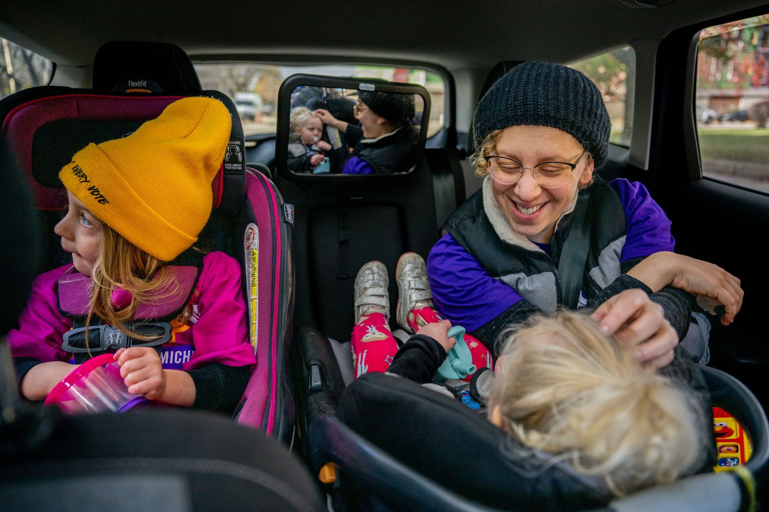 Rabbi Alana Alpert rides to a polling site in Detroit with her children Ne'ilah and Zohar on Election Day.