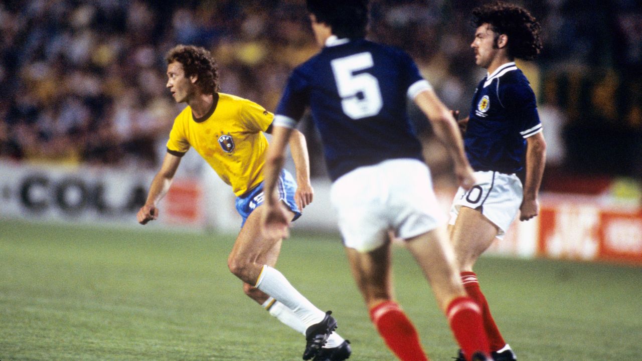 Scotland's John Wark defends Falcao during the group stage clash.