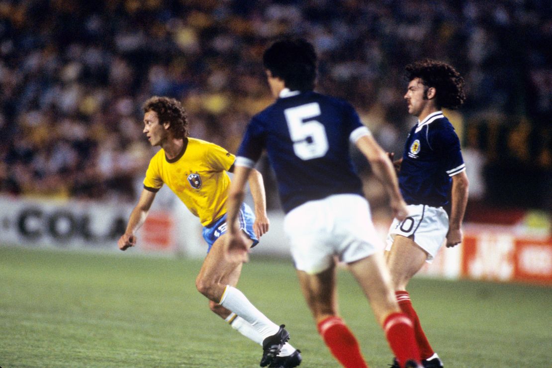 Scotland's John Wark defends Falcao during the group stage clash.