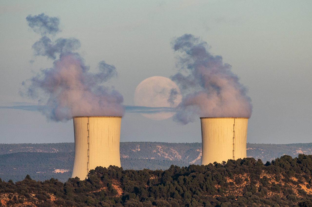 The full moon rises over the cooling towers of the Trillo Nuclear Power Plant in Guadalajara, Spain, on November 7.