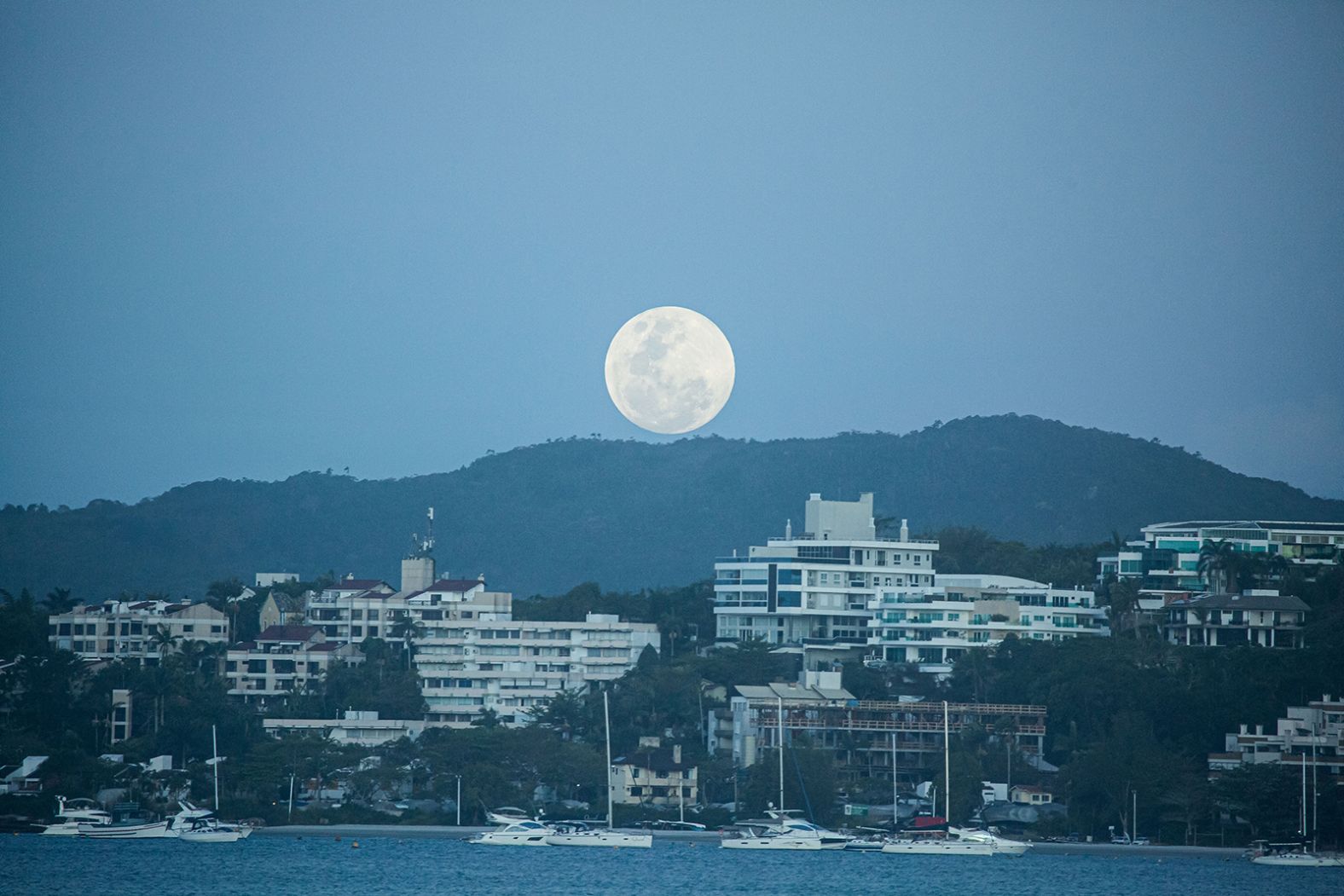 The full moon is seen on the beach of Jurerê Internacional in Florianópolis, Brazil, on November 8.
