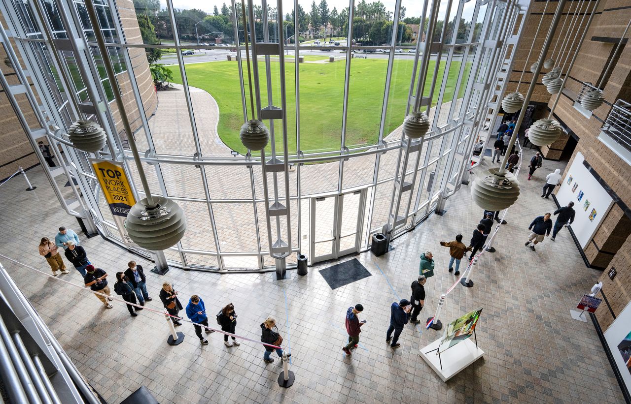 A line of voters stretches into the lobby at the Irvine Civic Center in Irvine, California, on Tuesday.