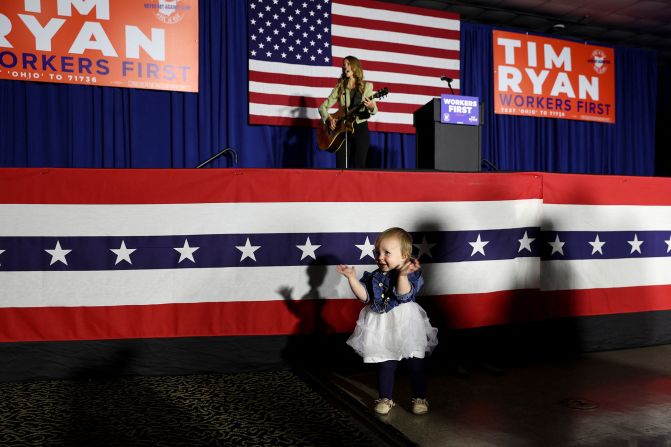 Lucy Grimes, 15 months old, plays in front of the stage at Ryan's watch party in Boardman, Ohio.