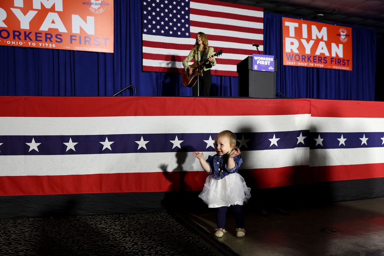 Lucy Grimes, 15 months old, plays in front of the stage at Ryan's watch party in Boardman, Ohio.