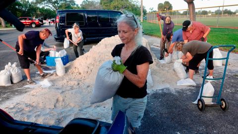 Sandbags are distributed Tuesday at Mills Pond Park in Fort Lauderdale, Florida.