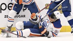 Edmonton Oilers left wing Evander Kane (91) is knocked to the ice during the second period of an NHL hockey game against the Tampa Bay Lightning Tuesday, Nov. 8, 2022, in Tampa, Fla. Kane would leave the ice after being cut on the play. (AP Photo/Jason Behnken)