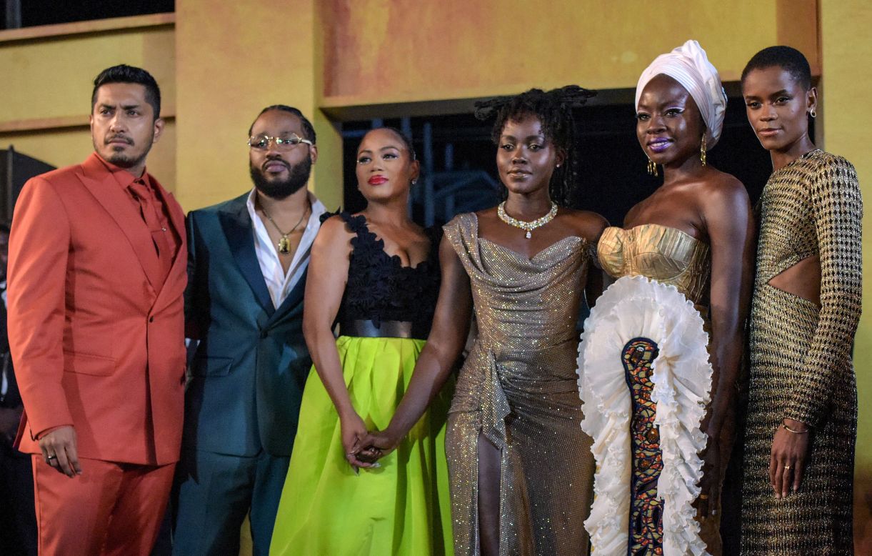 (L-R) Tenoch Huerta, US director Ryan Coogler and his wife Zinzi Evans, Lupita Nyong'o,  Danai Gurira, and Letitia Wright arrive for the premiere.