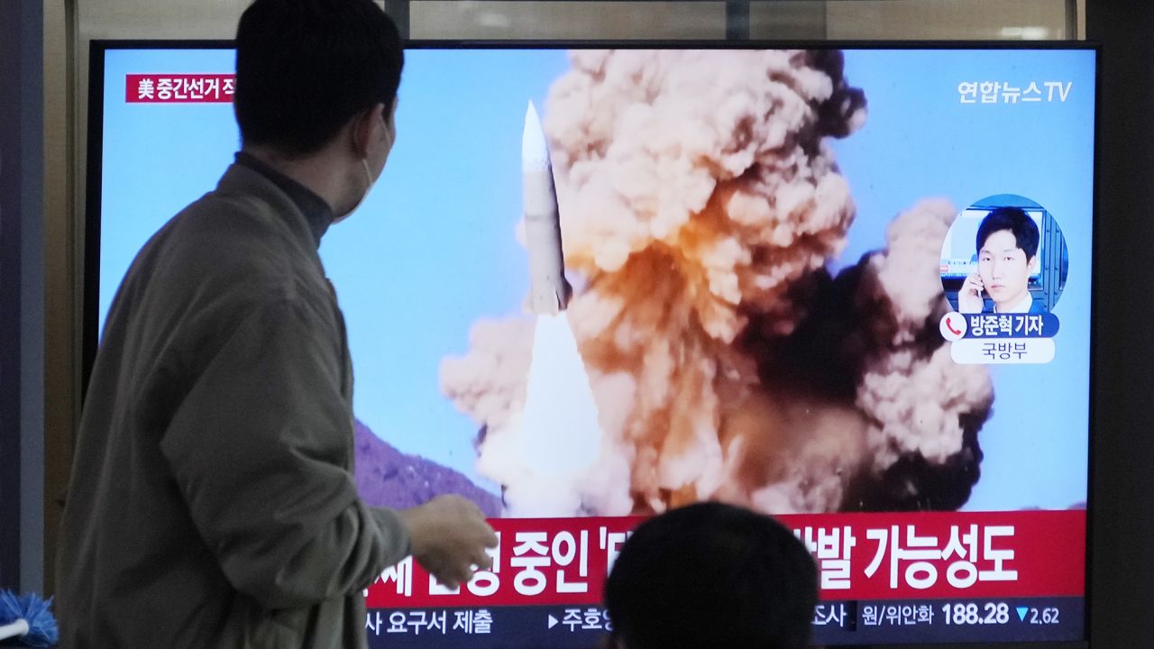 A TV screen at a railway station in Seoul shows file footage of a North Korean missile launch.