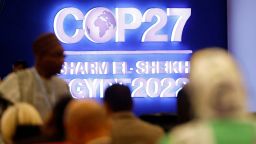 Attendees sit during the COP27 climate summit in Egypt's Red Sea resort of Sharm el-Sheikh, Egypt November 8, 2022. 