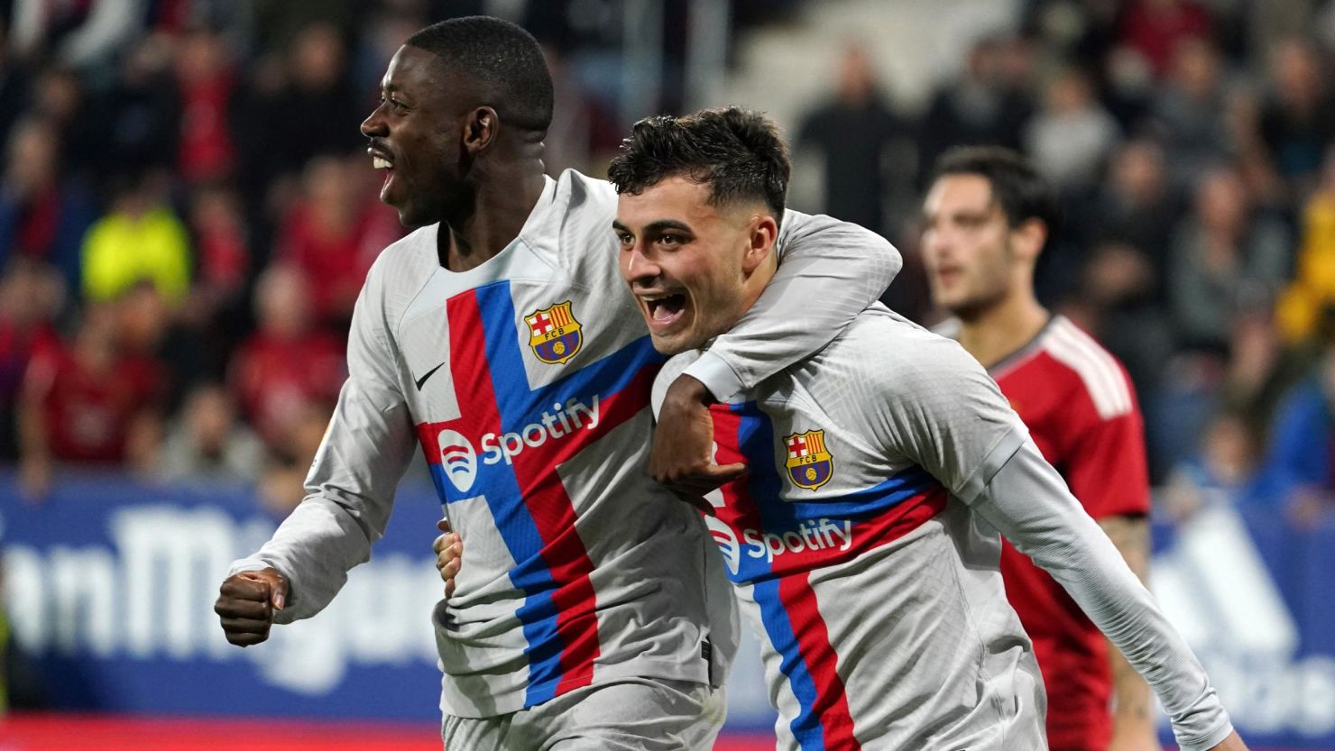 Pedri celebrates Barça's first goal against Osasuna with Ousmane Dembélé.