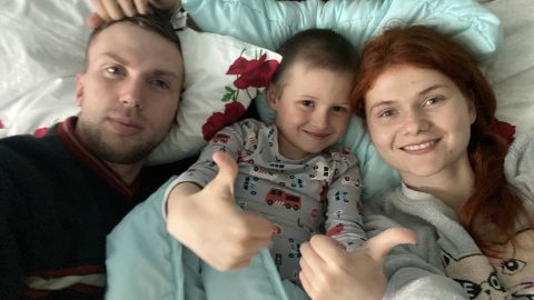 Ilya, center, has found new happiness with Vladimir Bespalov and Maria Bespalaya after losing both parents in the first week of the war.  