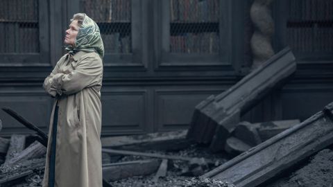 Imelda Staunton as Queen Elizabeth II surveys the damage of a devastating fire in