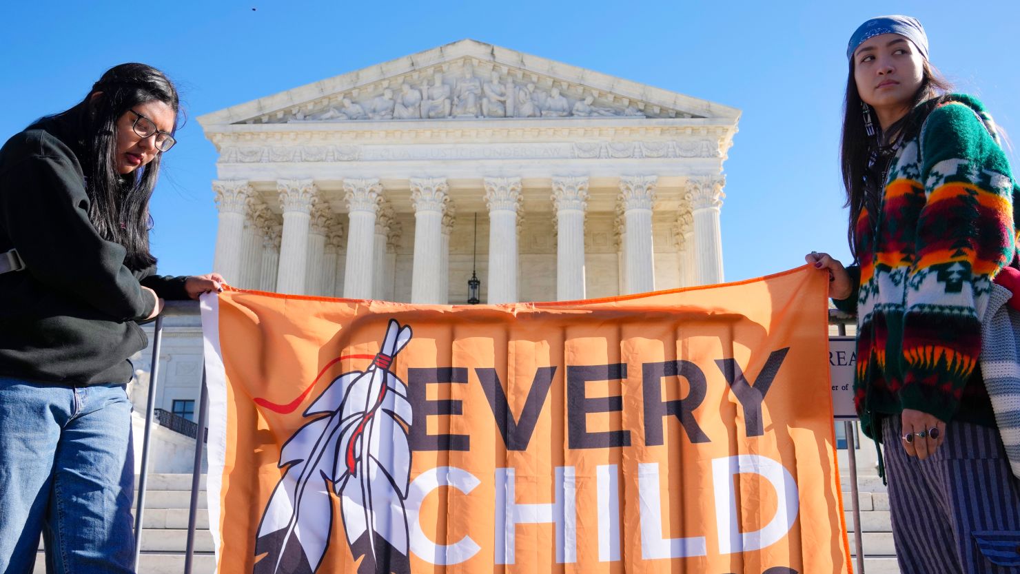 Demonstrators stand outside of the US Supreme Court on November 9, 2022 as the court heard arguments over the Indian Child Welfare Act. 