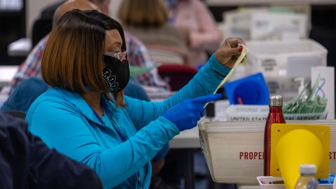 Election workers sort ballots at the Maricopa County Tabulation and Election Center on November 9 in Phoenix, a day after the midterm election.